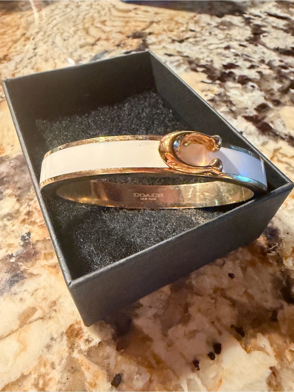 Coach Gold-Tone Hinge Bangle with White Enamel and Horsebit Detail
